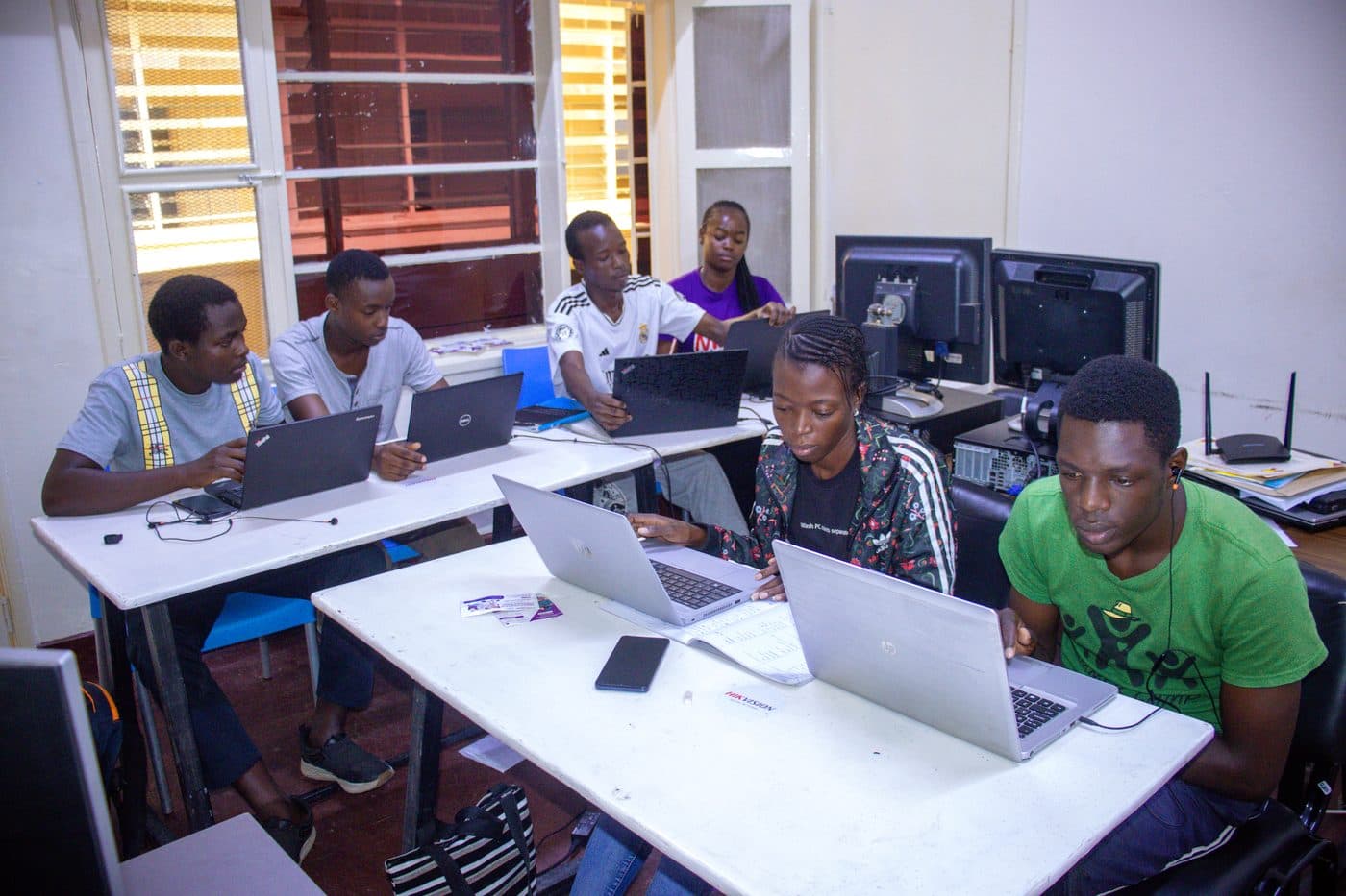 Digitika Academy students working on laptops in class